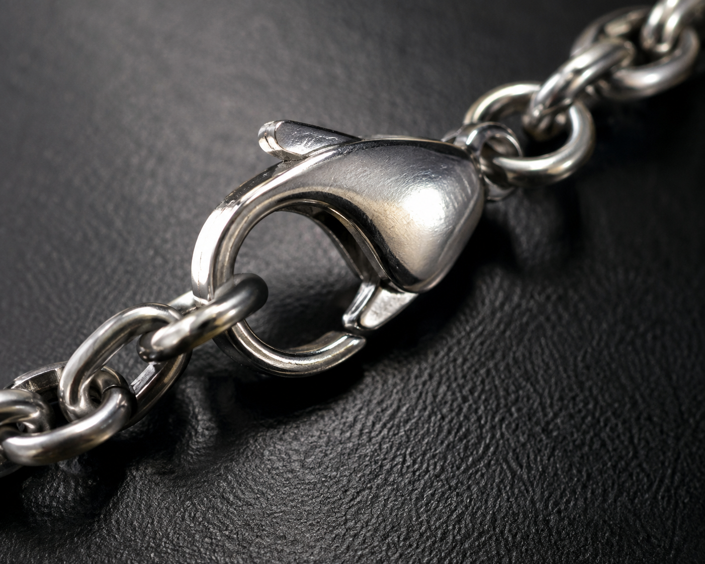 inspect-jewelry-clasps-and-settings.webp Close-up of a Shields of Strength necklace clasp being inspected in bright light